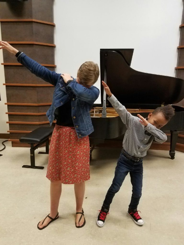 Being taught by my nine-year-old student the proper form for dabbing.