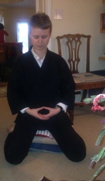 Demonstrating the zazen posture for my family at home in Texas.